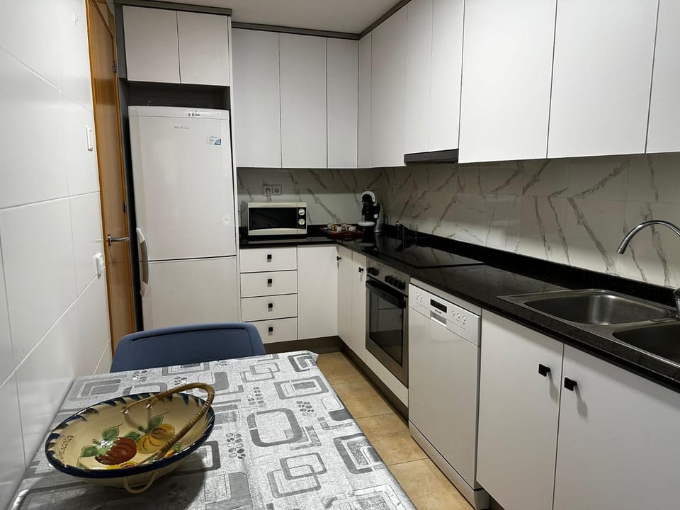 Kitchen or kitchenette, dishwasher, microwave, toaster, washing machine