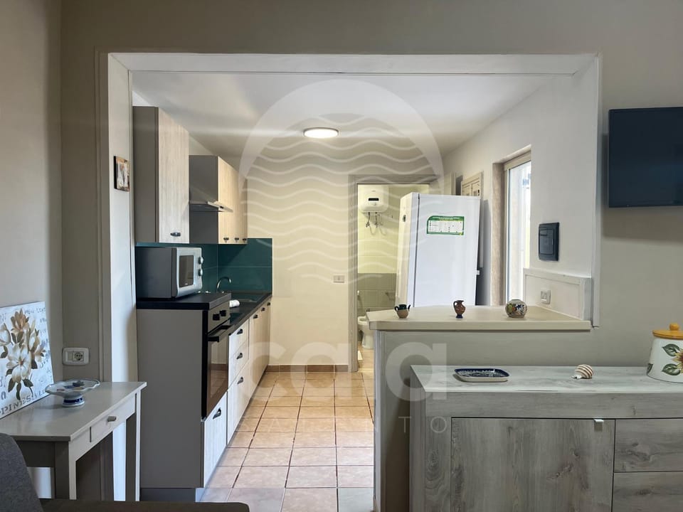 Kitchen or kitchenette, dishwasher, oven, stove