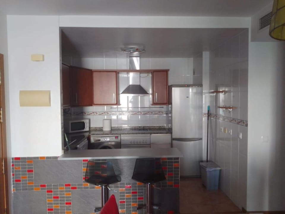Kitchen or kitchenette, oven, stove