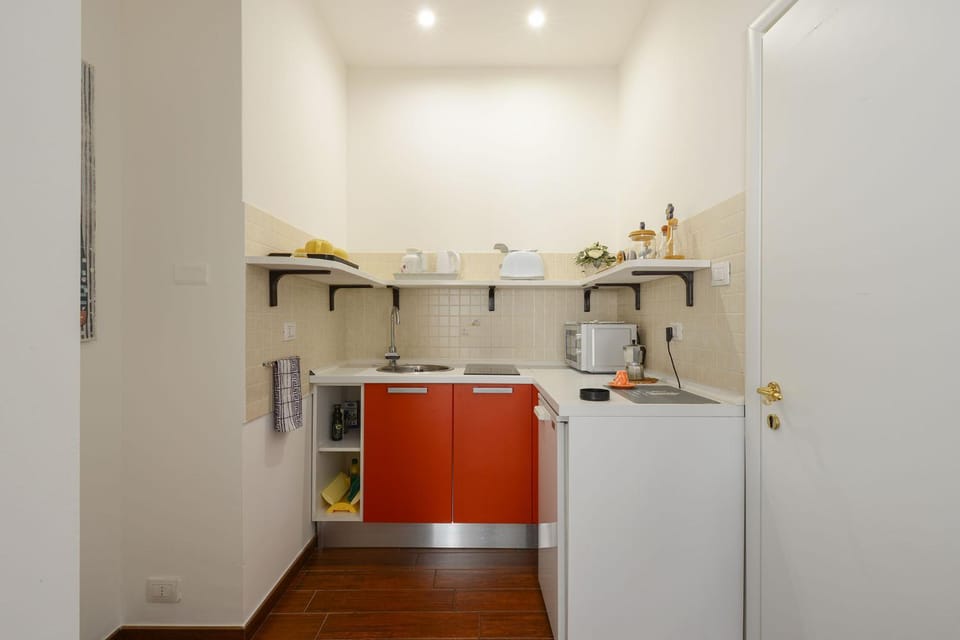 Kitchen or kitchenette, microwave, stove, toaster