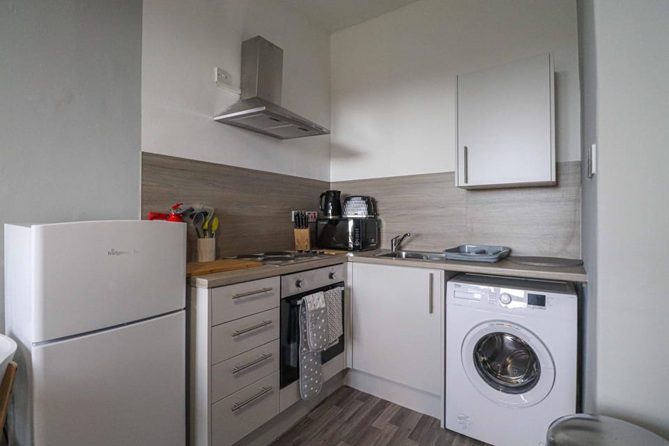 Kitchen or kitchenette, washing machine