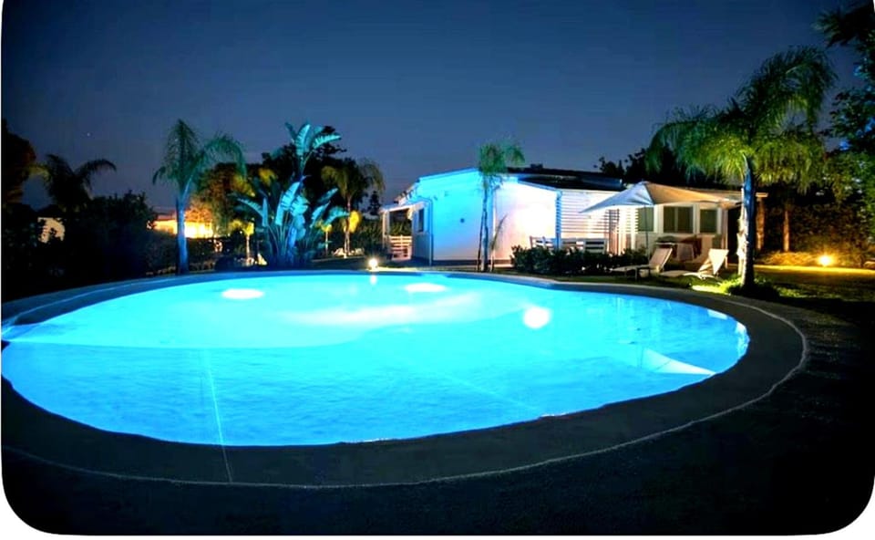 Property building, Night, Natural landscape, Pool view, Swimming pool