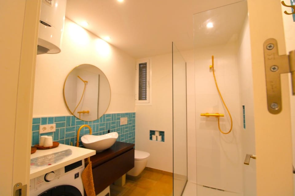 Shower, Toilet, Bathroom, towels, washing machine, dryer