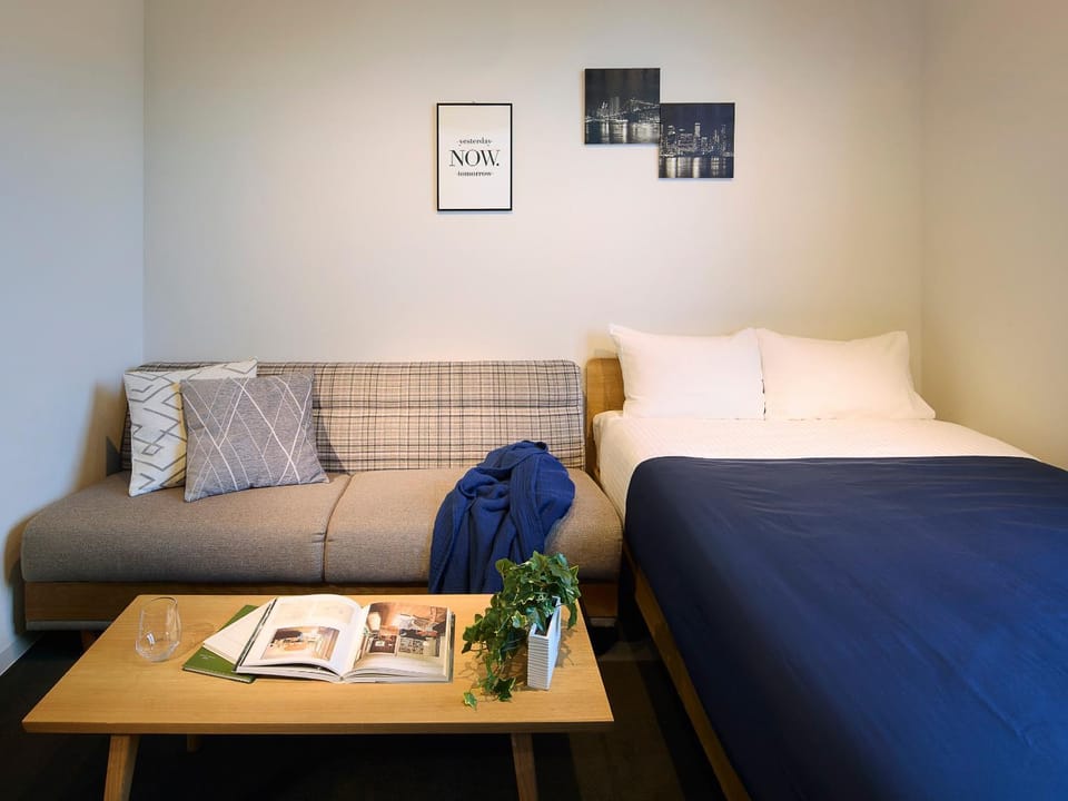 Bed, Living room, Seating area, Bedroom