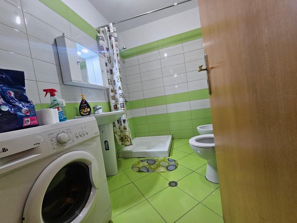 Shower, Toilet, Bathroom, bidet, towels, washing machine, dryer