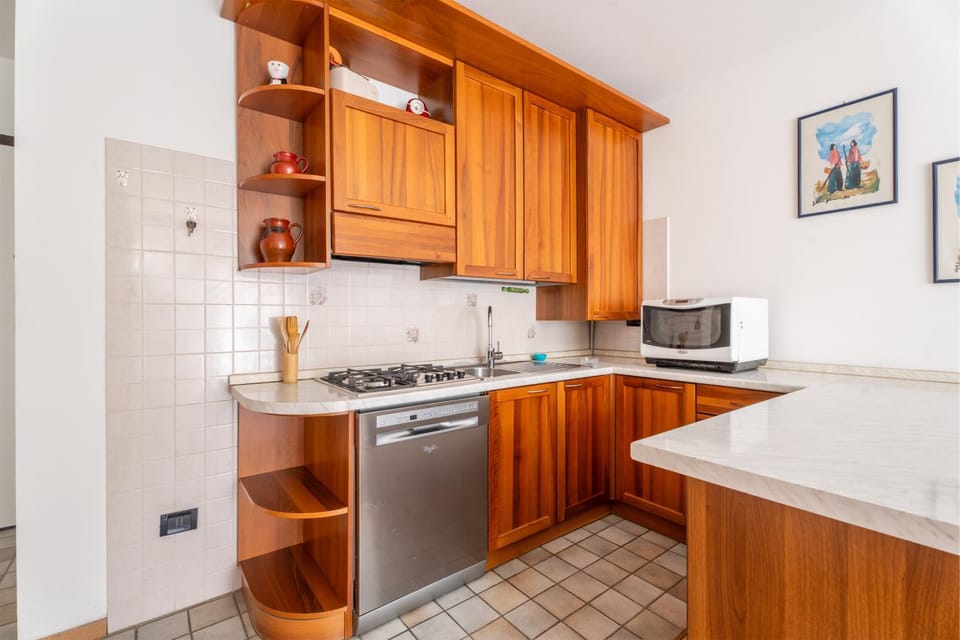 Kitchen or kitchenette, dishwasher, oven, stove