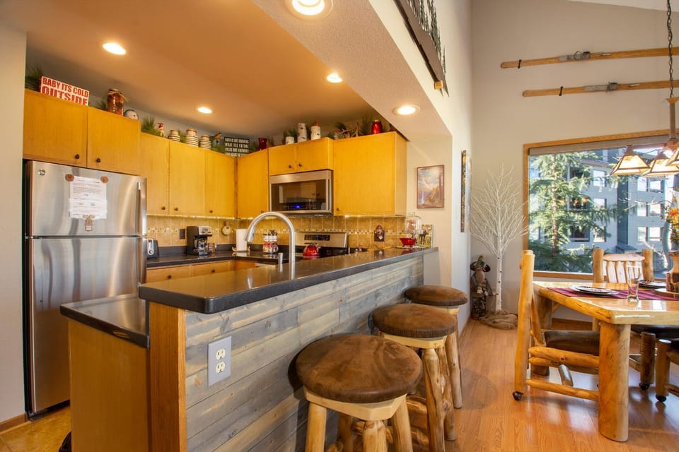 Kitchen or kitchenette, Seating area, Dining area, furniture, microwave, oven