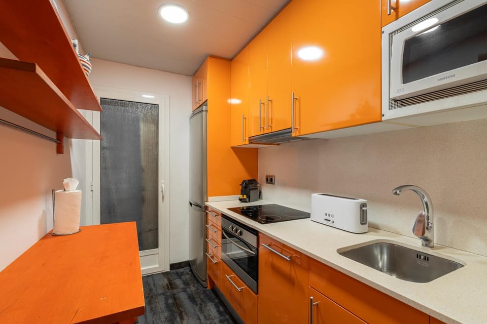 Kitchen or kitchenette, dishwasher, oven, stove