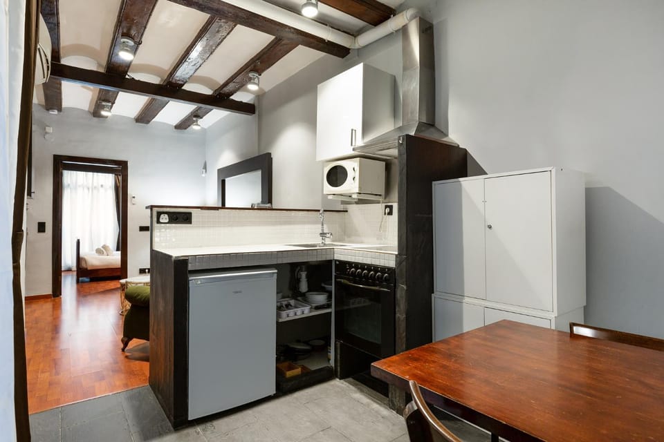 Kitchen or kitchenette, dishwasher, oven, stove