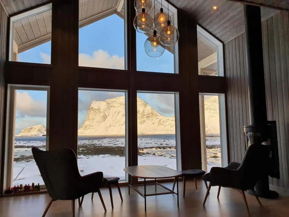 View (from property/room), Living room, Seating area, Mountain view, Sea view, fireplace