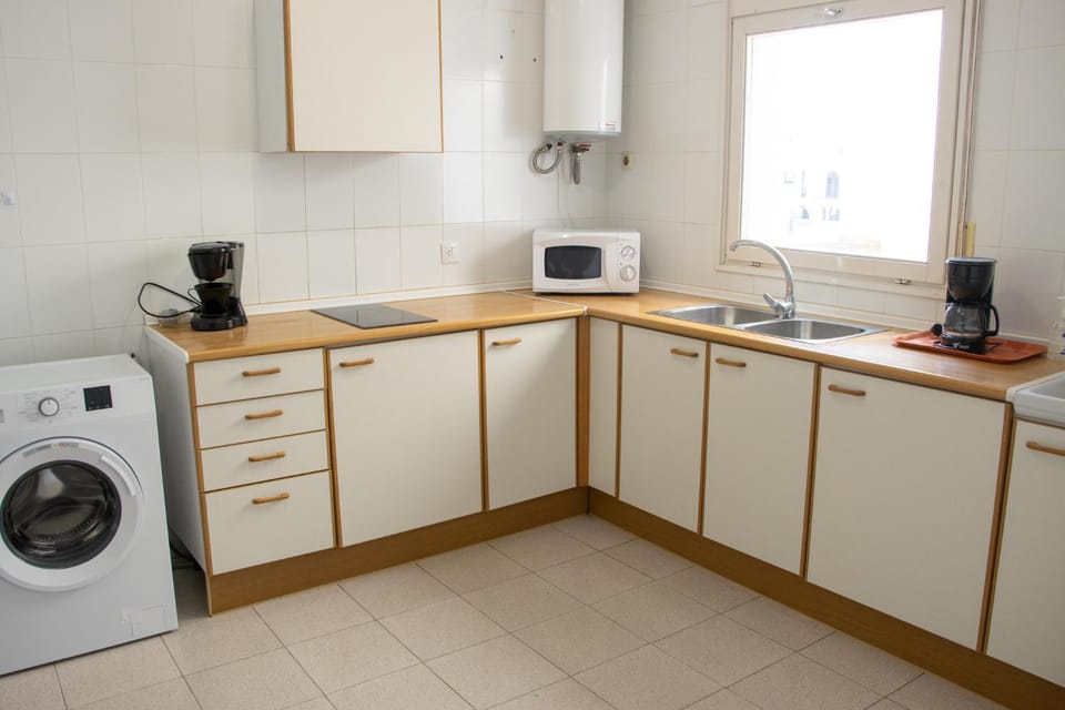 Kitchen or kitchenette, toaster, washing machine