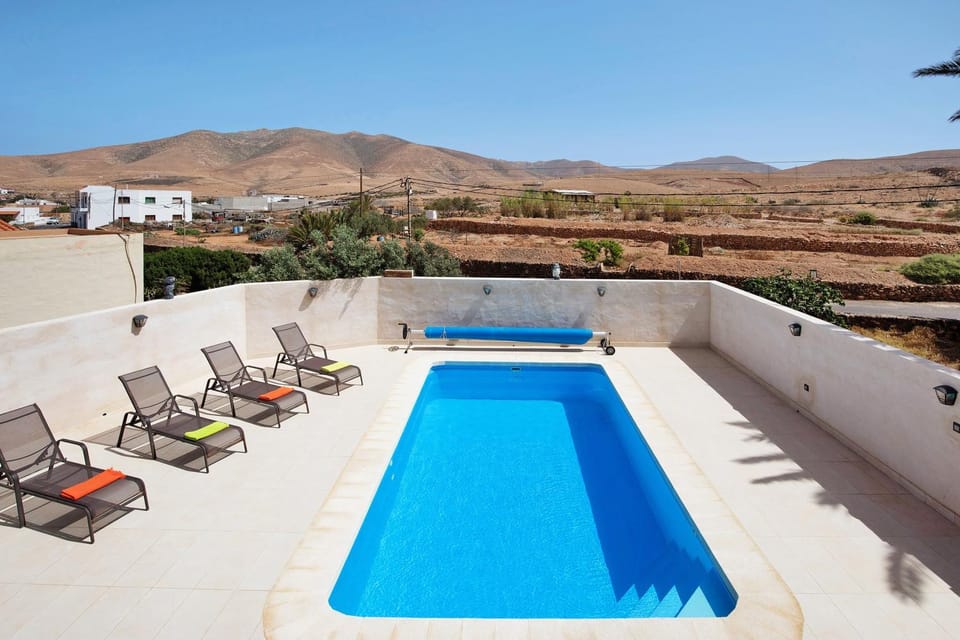 Property building, Living room, Swimming pool
