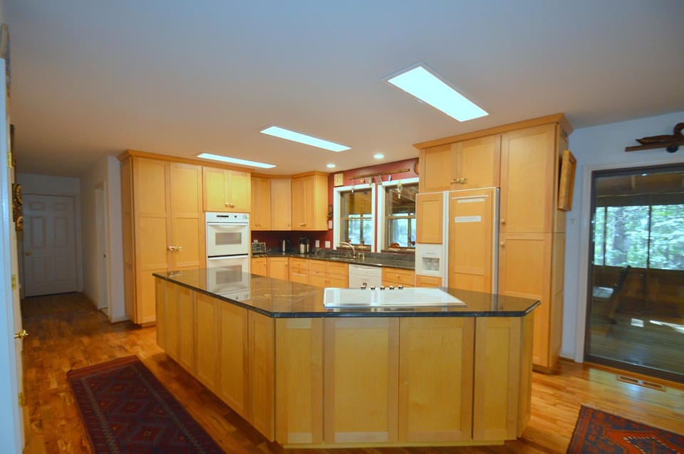 Kitchen or kitchenette, dishwasher, oven, stove, toaster
