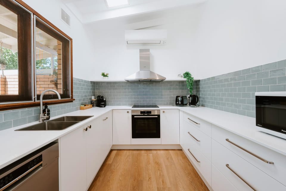 Kitchen or kitchenette, dishwasher, oven, stove, toaster