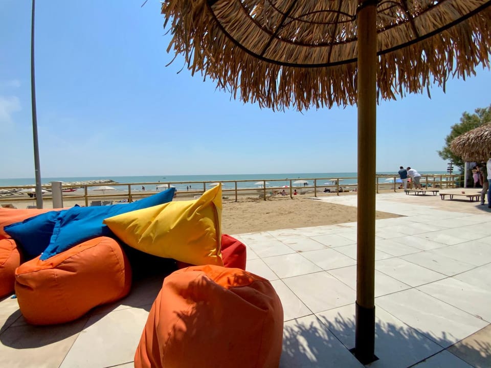 Patio, Nearby landmark, Day, Natural landscape, Seating area, Beach, Evening entertainment, Sea view