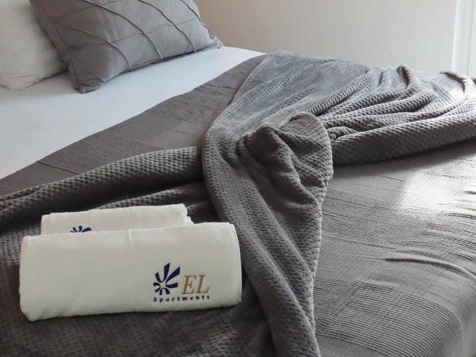 Bed, Property logo or sign, Bedroom
