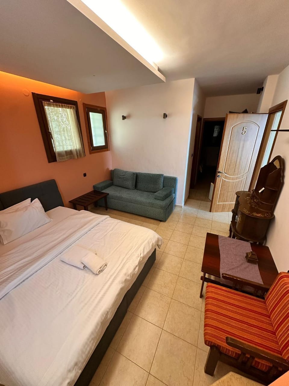 Bed, Living room, Seating area, Bedroom