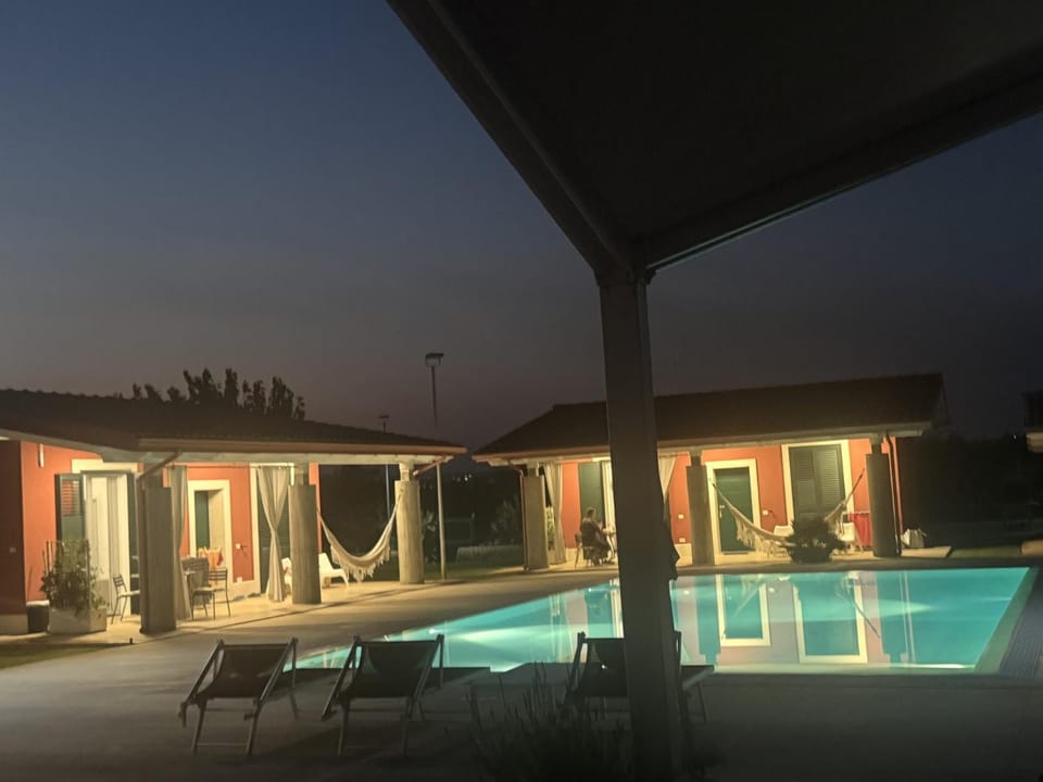 Patio, Night, Pool view, Swimming pool, sunbed