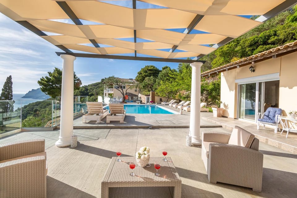 Property building, Bird's eye view, Lounge or bar, Seating area, Sea view, Swimming pool, Sunset