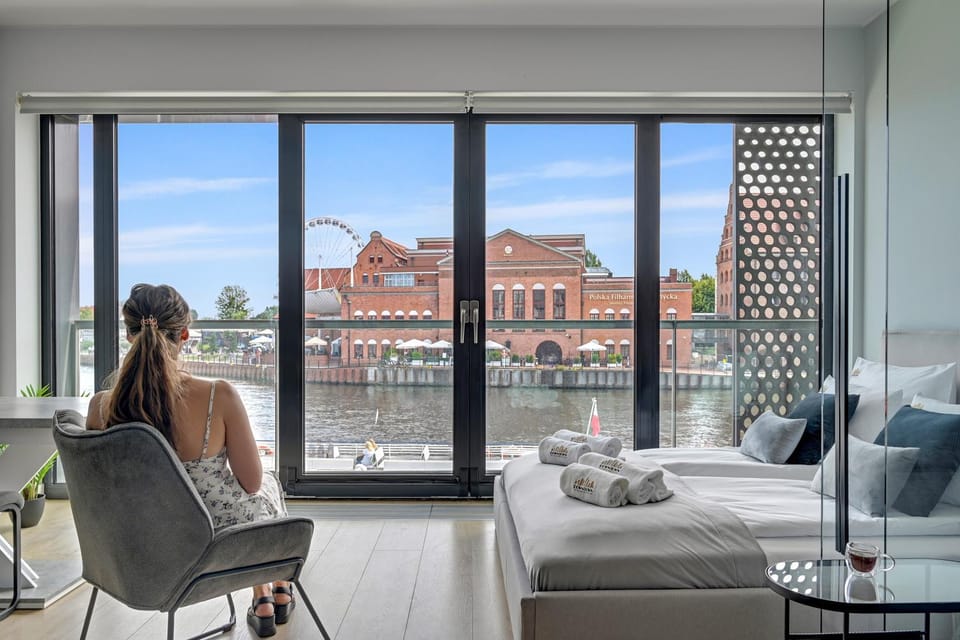 People, View (from property/room), Living room, Seating area, Dining area