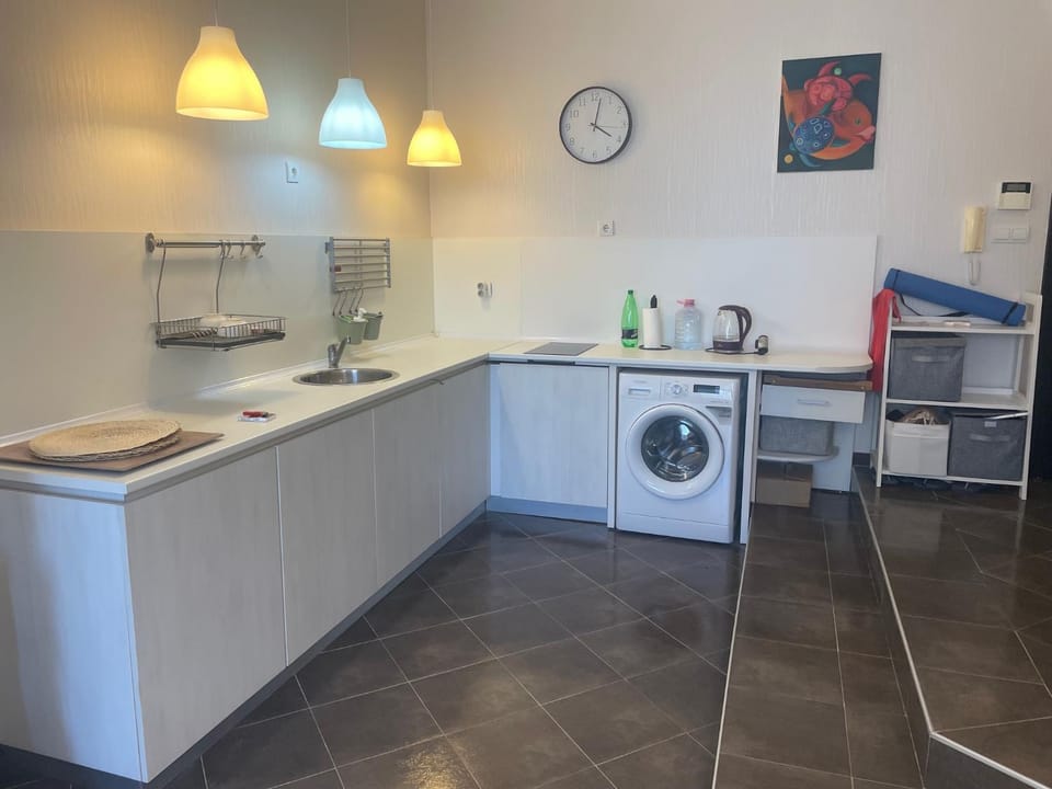 Kitchen or kitchenette, stove, washing machine