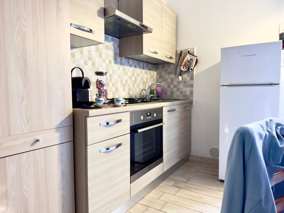 Kitchen or kitchenette, oven, stove