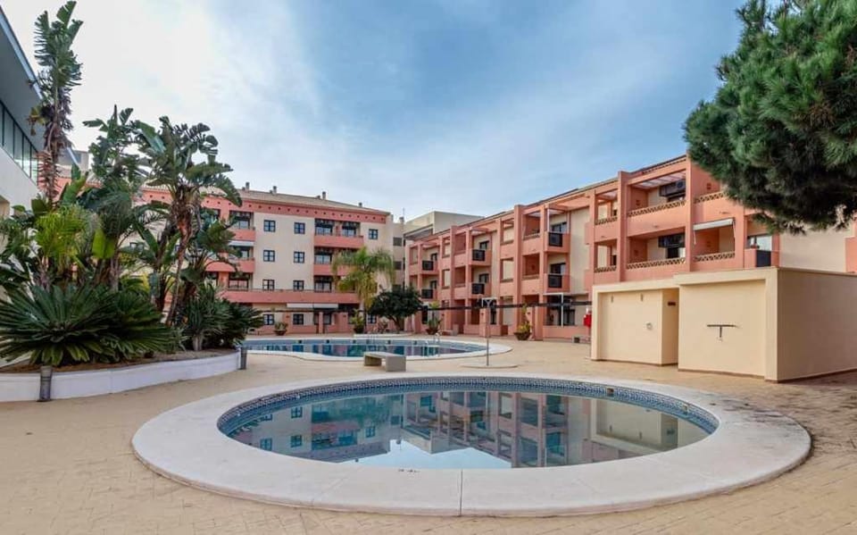 Apartamento junto a la playa con piscina y parking Apartment in Punta Umbría