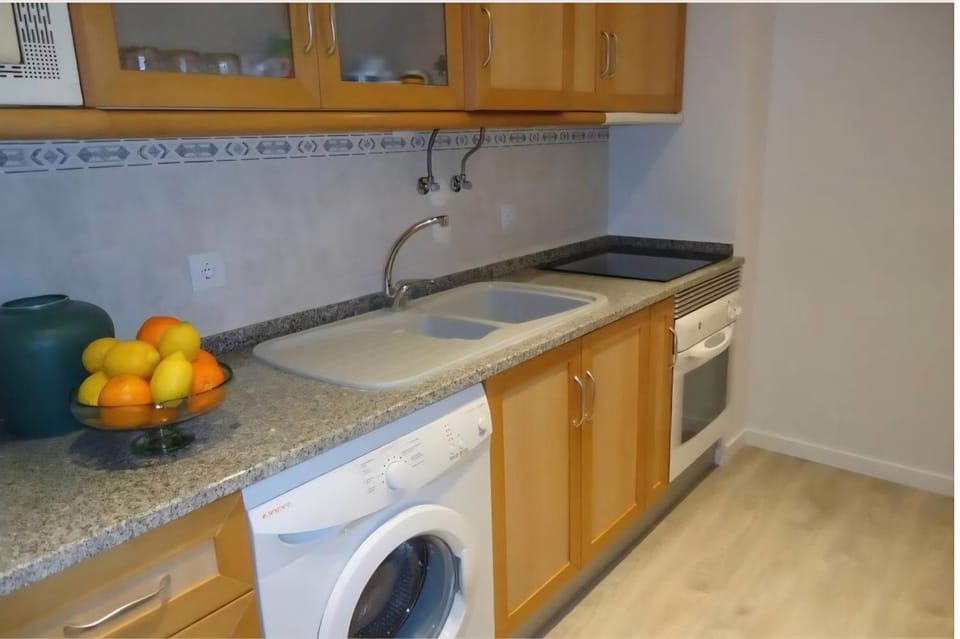 Kitchen or kitchenette, washing machine