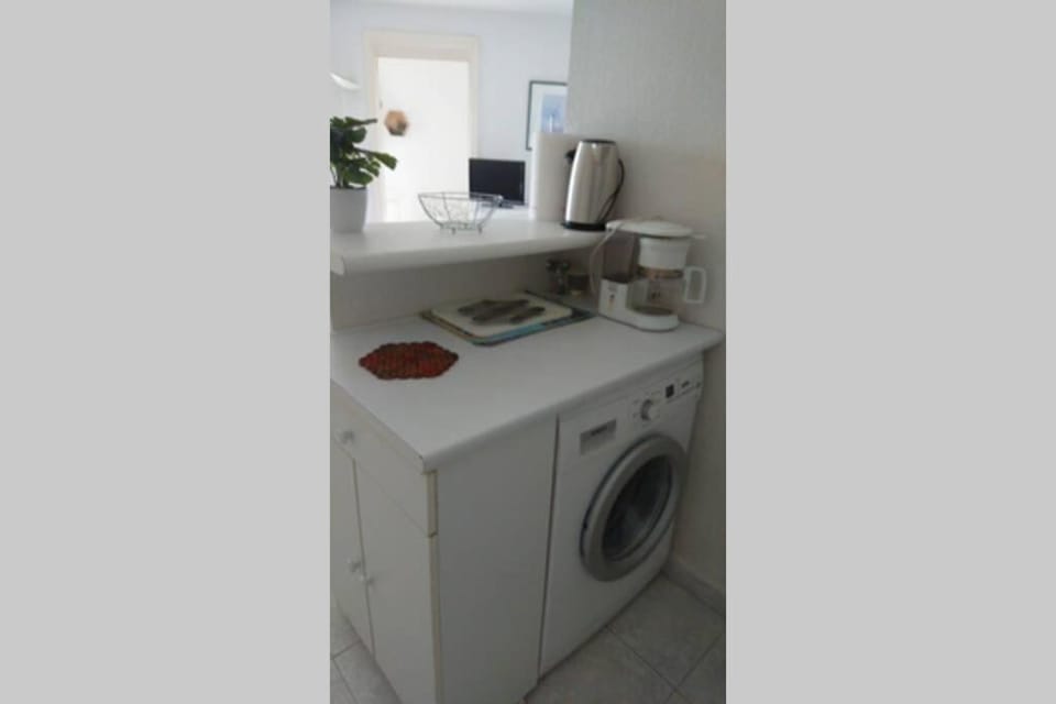 Kitchen or kitchenette, washing machine
