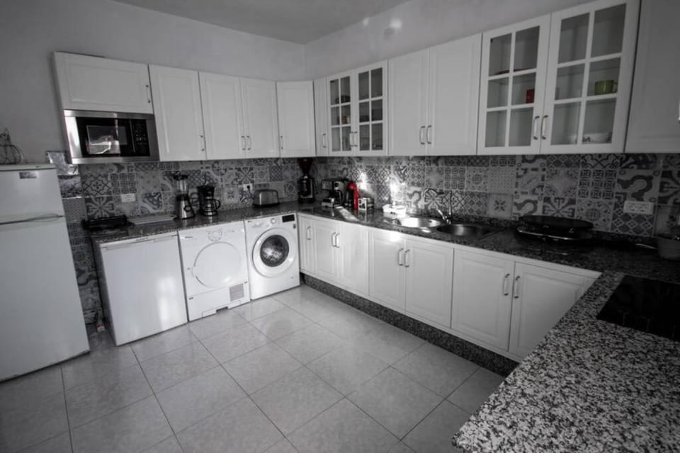 Kitchen or kitchenette, oven, stove, toaster, washing machine, dryer