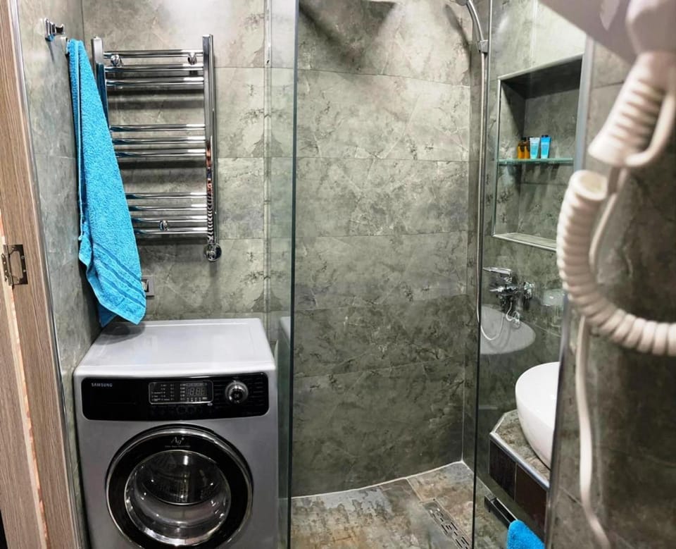 Shower, towels, washing machine, dryer
