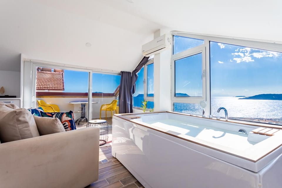 Bed, Living room, Seating area, Bedroom, Sea view