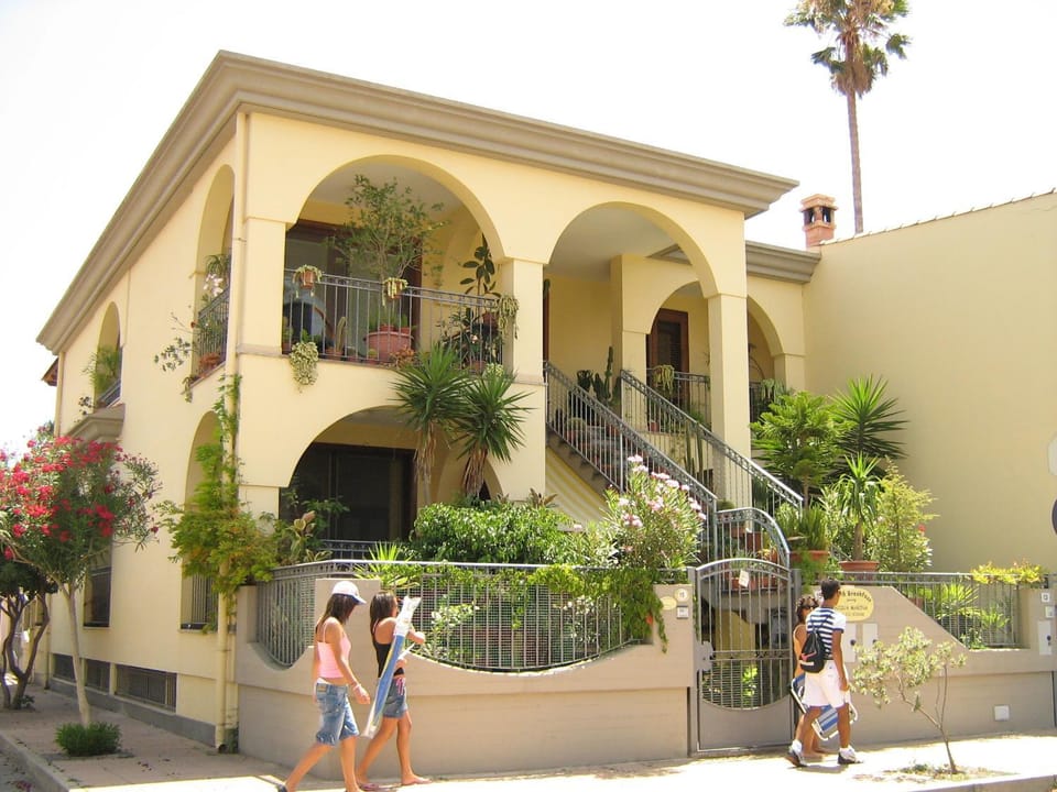Property building, Facade/entrance, People, Garden, View (from property/room), group of guests