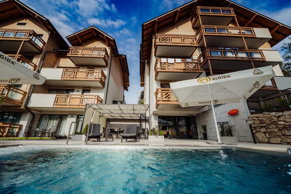 Property building, Patio, Balcony/Terrace, Pool view, Swimming pool, sunbed