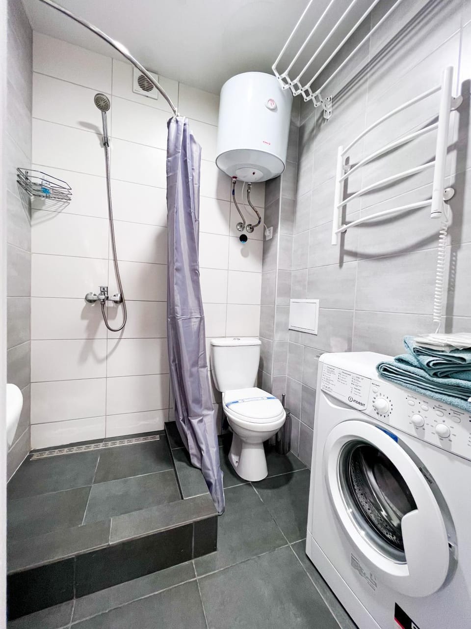 Shower, Toilet, towels, washing machine, dryer