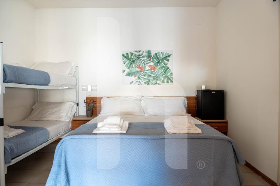 Bed, bunk bed, minibar, towels
