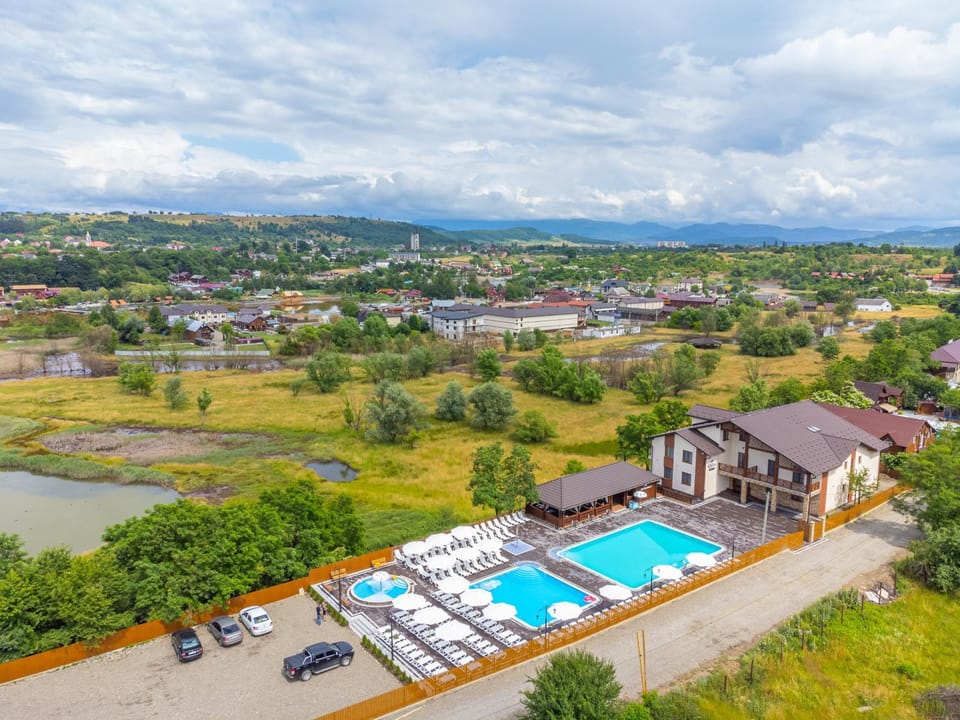 Property building, Day, Bird's eye view, Mountain view, Pool view, Street view, Swimming pool, Location, Parking