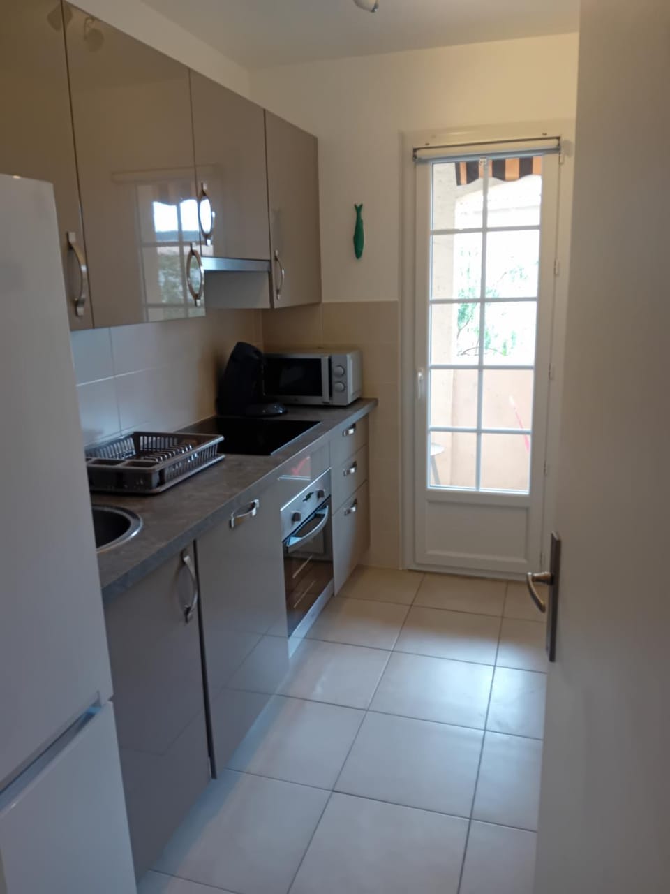 Kitchen or kitchenette, dishwasher, microwave, oven, stove, toaster