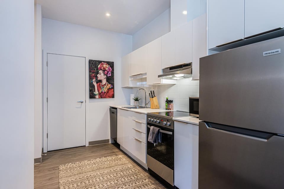 Kitchen or kitchenette, dishwasher, microwave, oven, stove