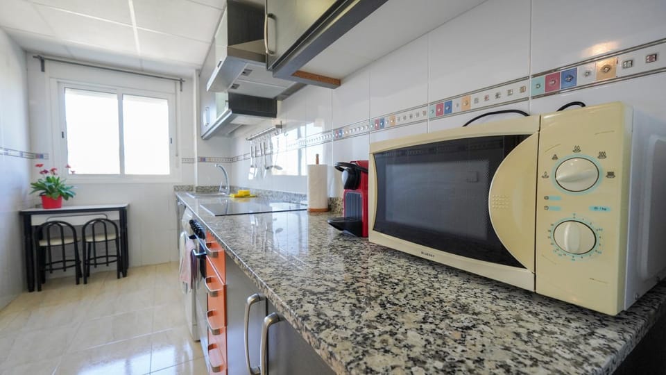 Kitchen or kitchenette, microwave, stove