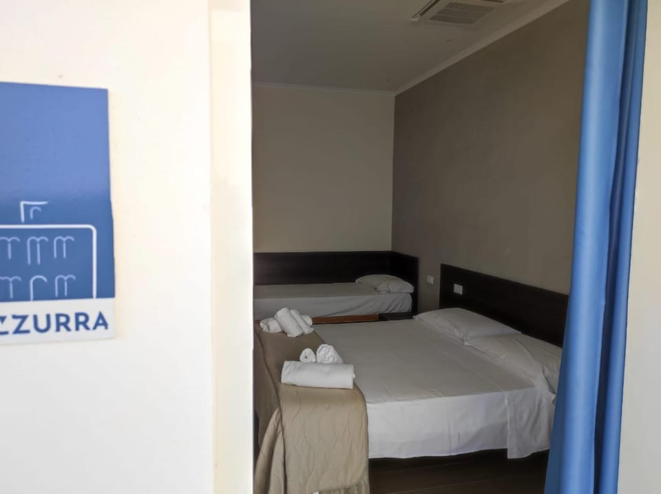 Bed, Photo of the whole room, Bedroom, Text overlay, towels