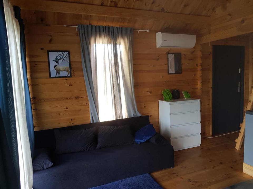 Property building, Living room, Seating area, air conditioner