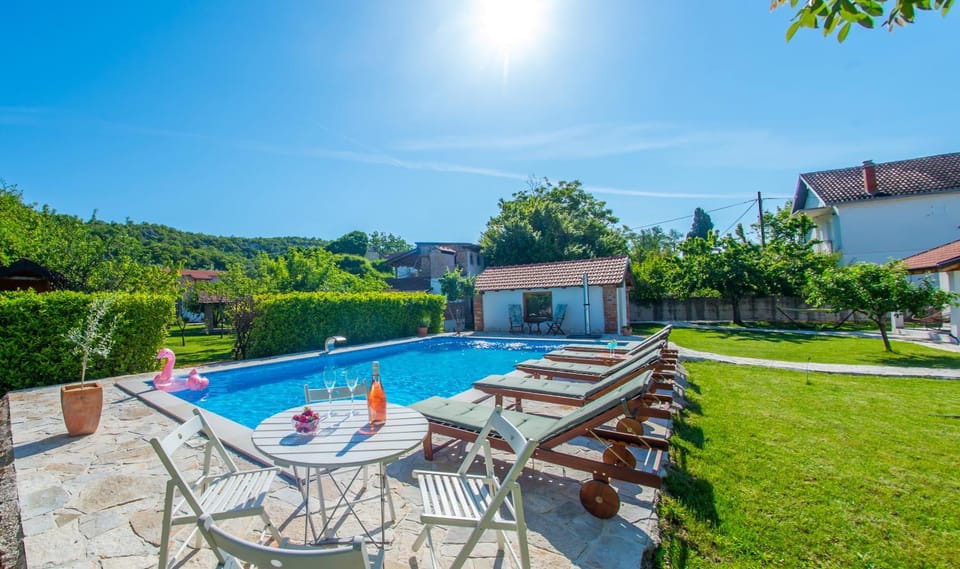 Patio, Day, Garden, Pool view, Swimming pool, sunbed