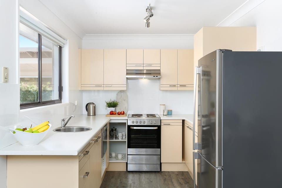 Kitchen or kitchenette, dishwasher, oven, stove, toaster