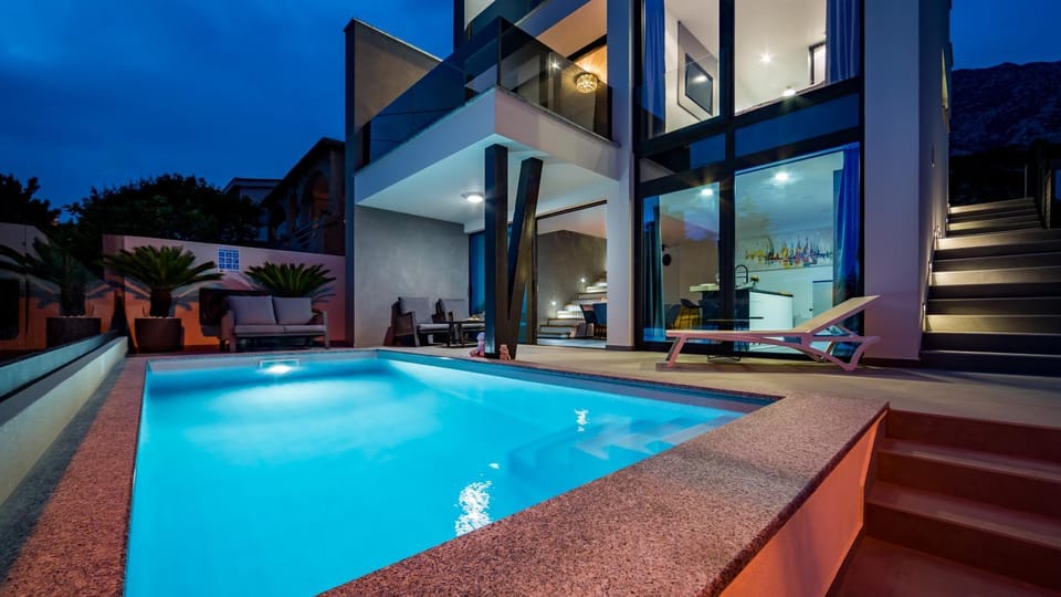 Property building, Patio, Night, Pool view, Swimming pool, sunbed