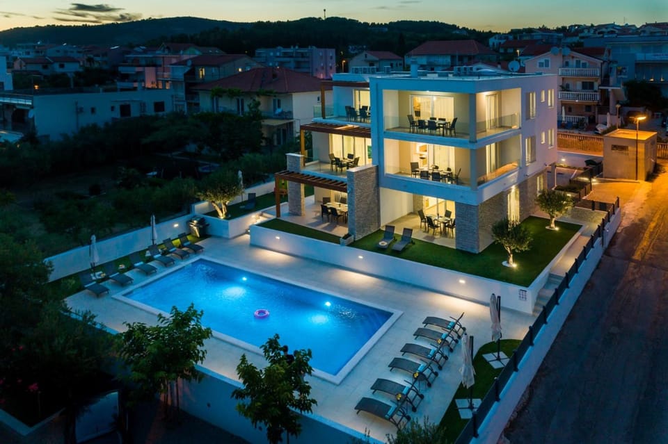 Property building, Patio, Night, Natural landscape, Pool view, Swimming pool, sunbed