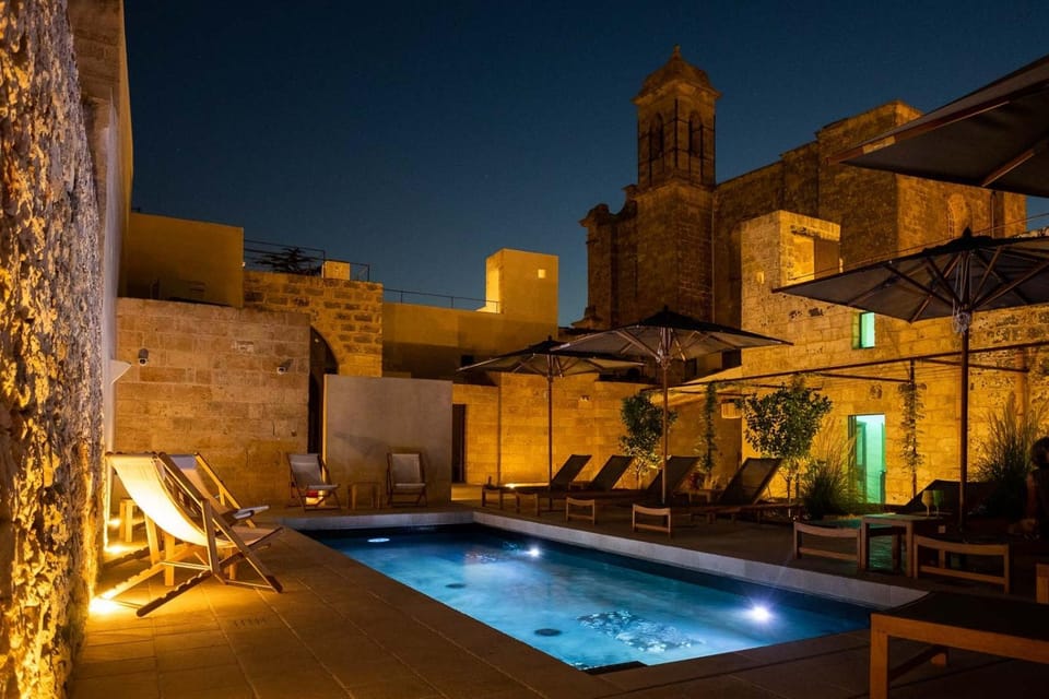 Patio, Night, Pool view, Swimming pool, sunbed