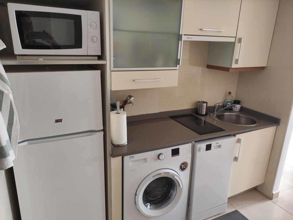 Kitchen or kitchenette, dishwasher, stove, washing machine