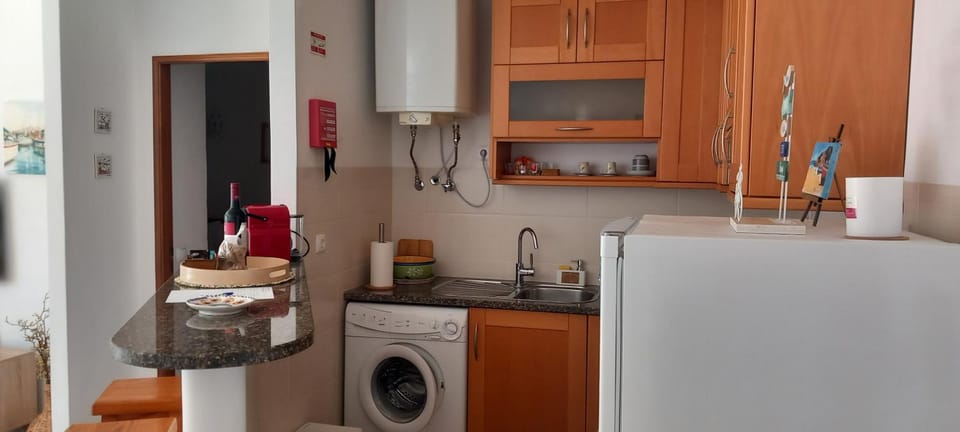 Kitchen or kitchenette, washing machine