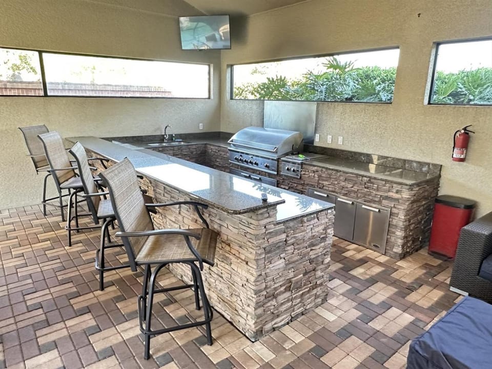 Luxurious Getaway Pool Hot Tub Theater Gym Outdoor Kitchen BBQ 2 Miles to Disney House in Four Corners
